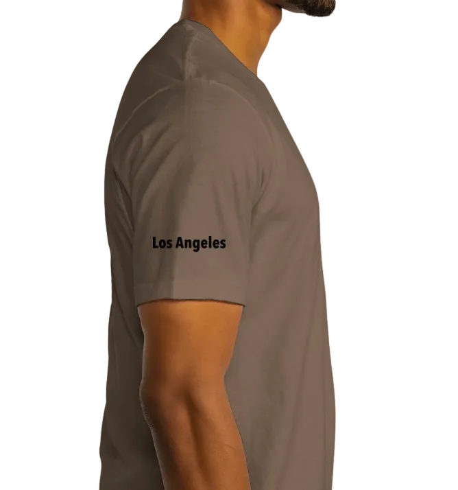 Person wearing a brown t-shirt with 'Los Angeles' text on a white background