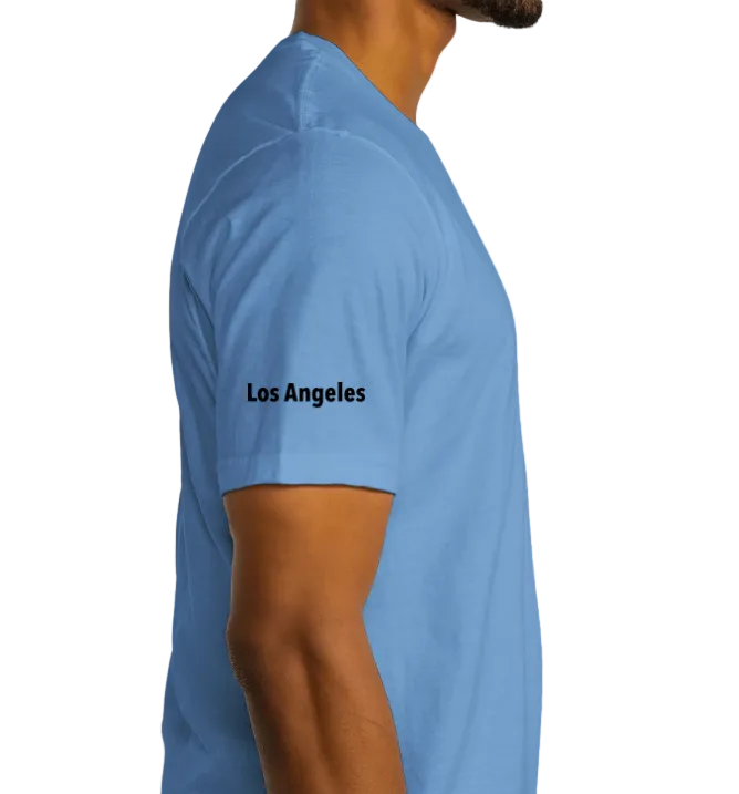 Person wearing a blue t-shirt with 'Los Angeles' text on a white background